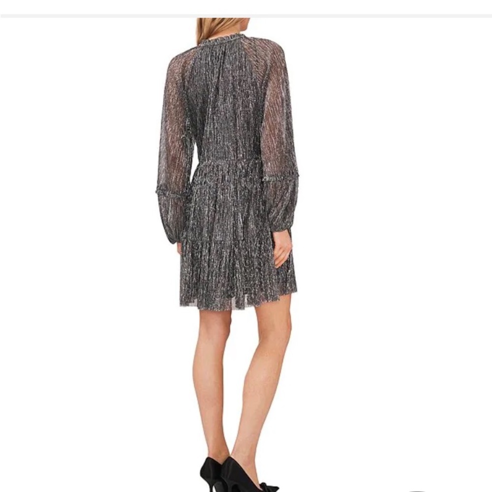 CeCe black metallic long sleeved dress. Size large. New with tags.